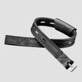 A black leather watch strap with silver-toned metal hardware, shown on a light gray background.