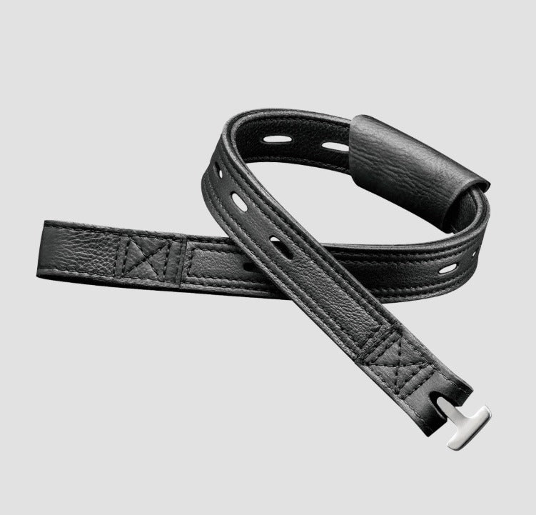 A black leather watch strap with silver-toned metal hardware, shown on a light gray background.